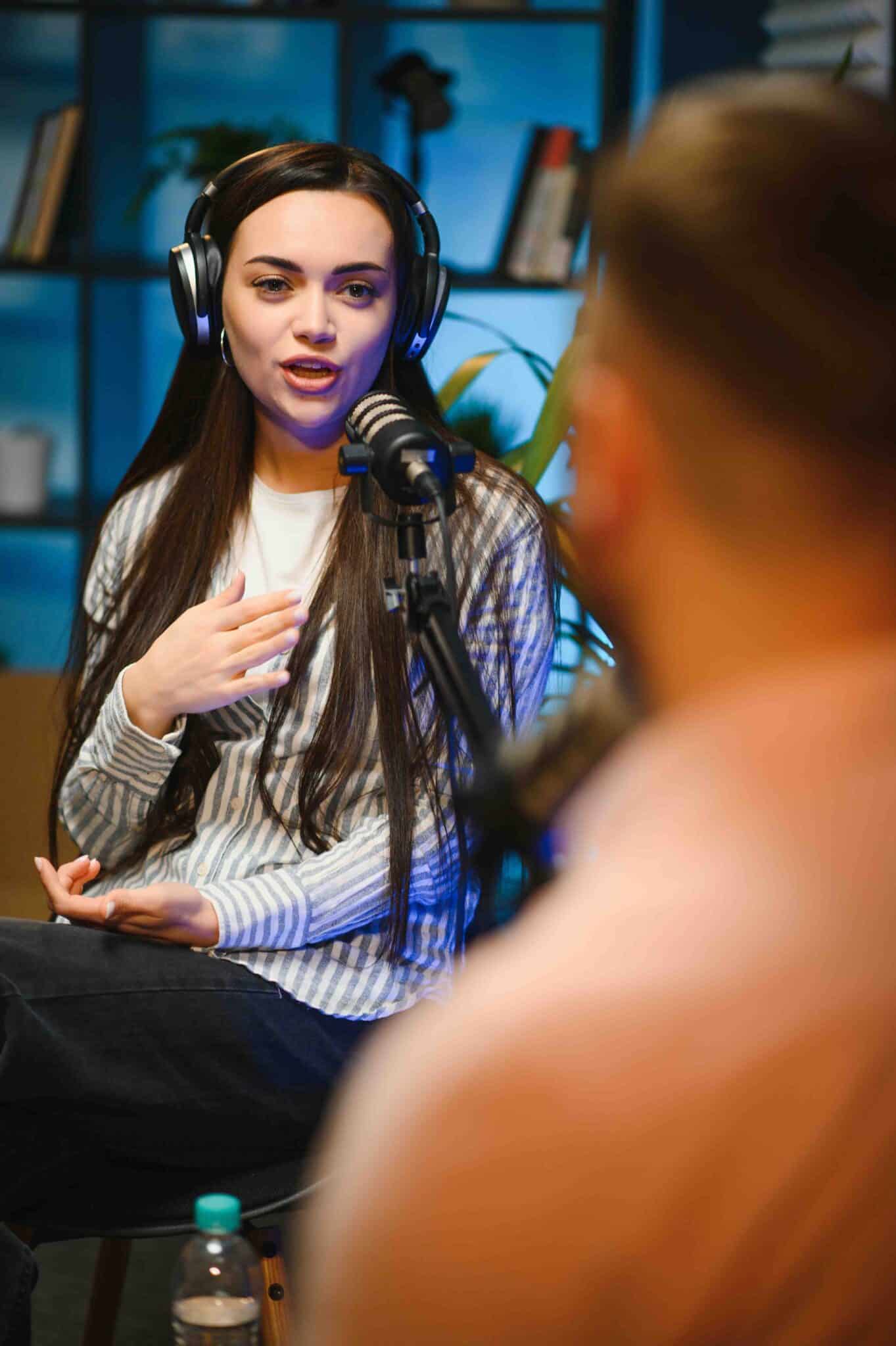 Show host interviewing woman